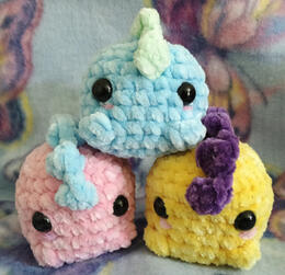 Pocket dinosaurs: one blue, one pink, and one yellow!