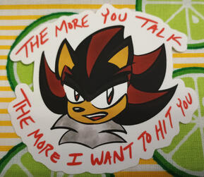 A head shot of Shadow the Hedgehog with the text surrounding him stating "The more you talk; the more I want to hit you."