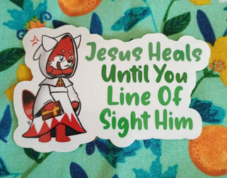 A Red Panda in a White Mage outfit sticker that says "Jesus Heals Until You Line Of Sight Him"